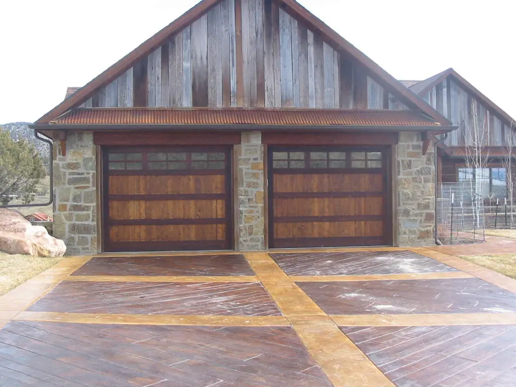 Timber and stone garage with custom double doors