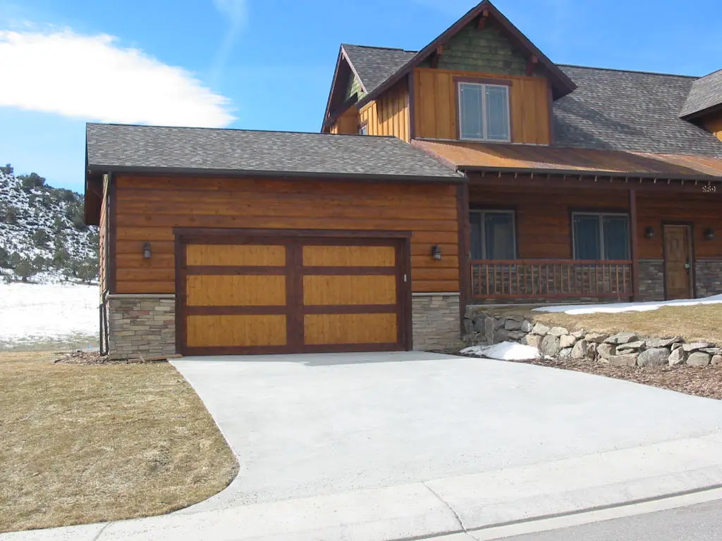 Wood and glass garage doors on a custom home